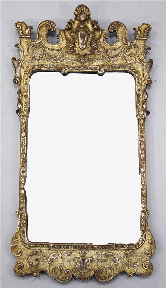 A George II style carved silvered wood framed wall mirror, Height 3ft 1in. Width 1ft 8in. H.3ft 1in.